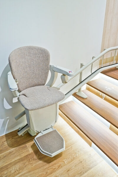 Brown curved stairlift.